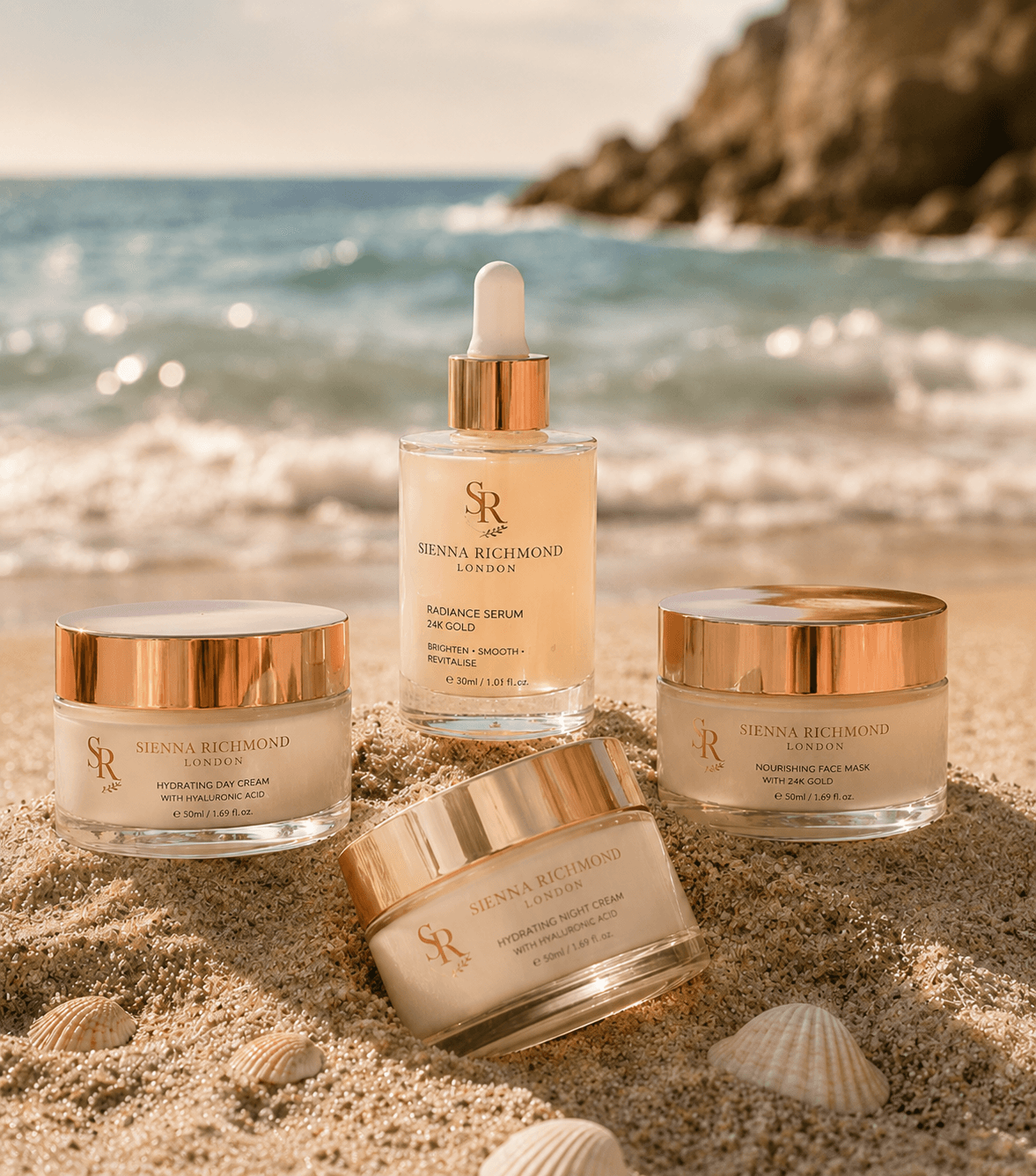 Sienna Richmond London skincare products on a sandy beach with ocean waves and seashells.
